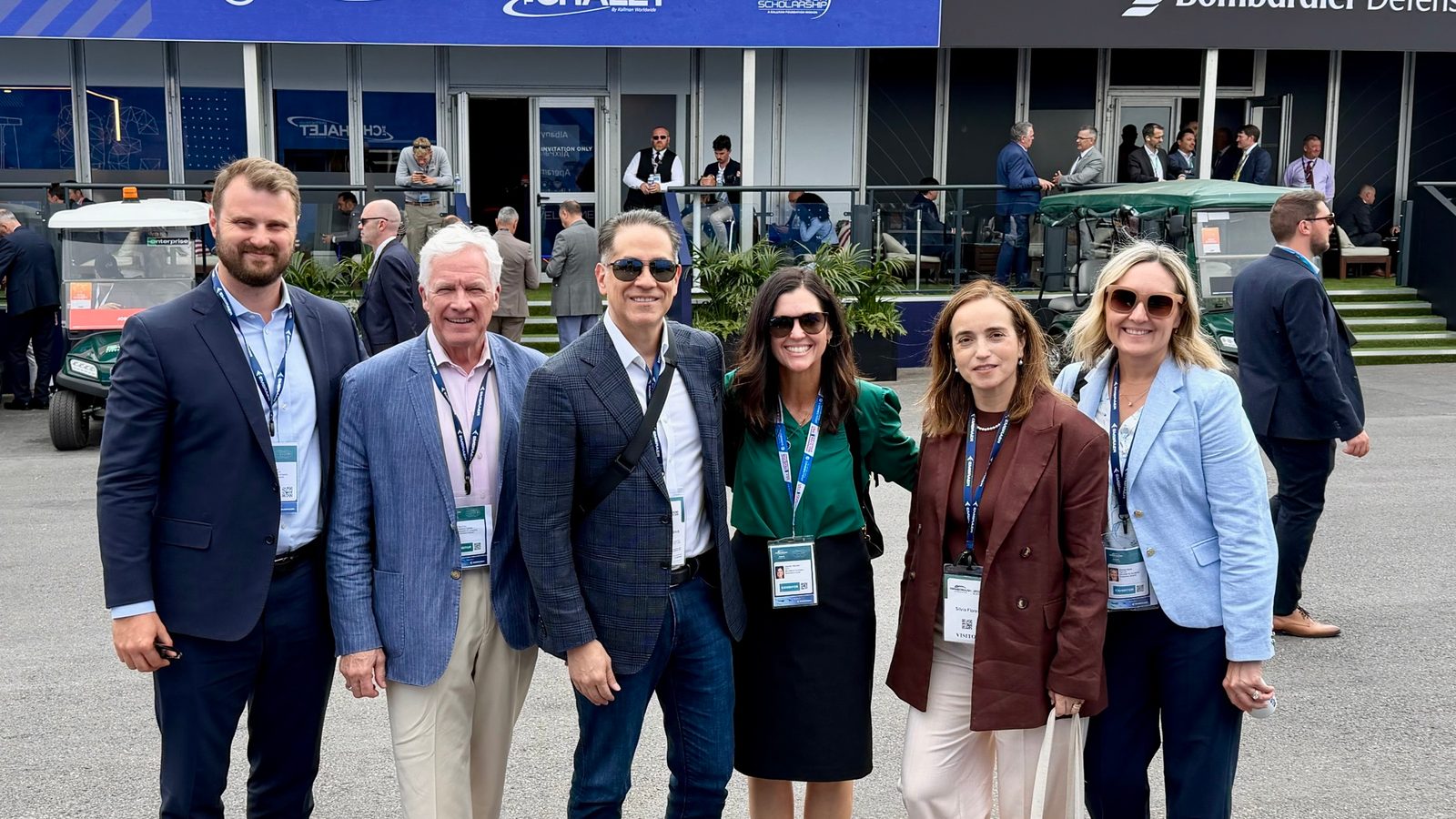 Silvia Flores with colleagues at The Chalet by Kallman on Day 2 of Farnborough International Airshow 2026, with the Bombardier Defense chalet visible in the background.
